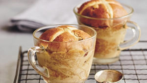 Golden bread and butter pudding in a glass mug