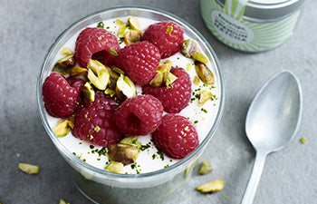 a tasty matcha breakfast bowl with chia seeds and fresh raspberries
